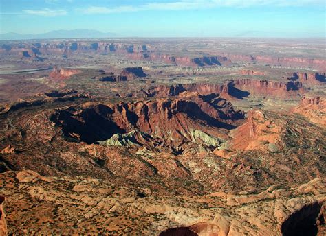 Dips of 70 degrees have been measured in the Kayenta Formation on the U-shaped plateau surrounding the center of the structure. . Which of the layers of upheaval dome are most resistant to erosion